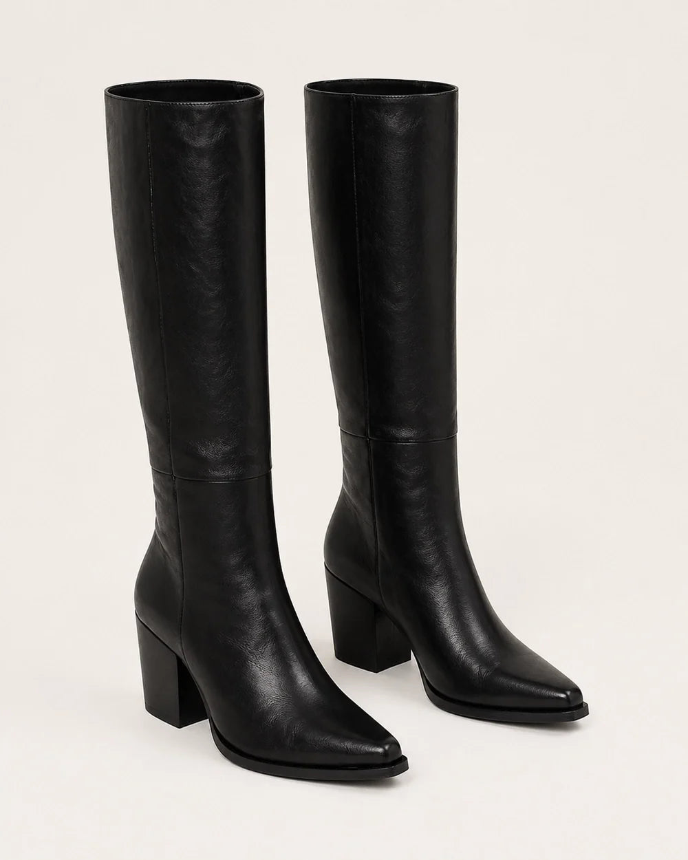 Black pointed-toe knee-high boots, product-only view