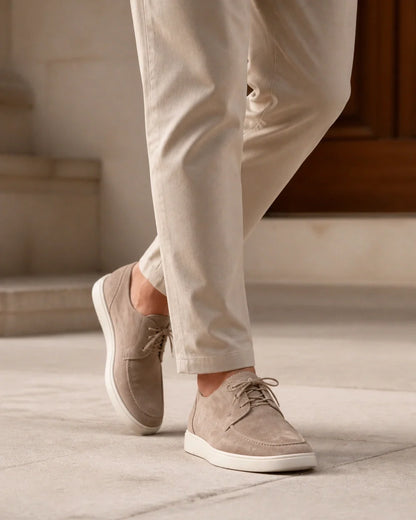 Men wearing beige lace-up moccasins in motion.