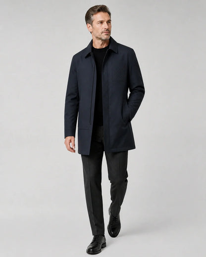 Dark blue mid-length coat for men, walking studio view.