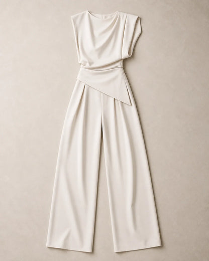 Women's white asymmetric draped top and wide-leg trousers set, product-only flat lay.