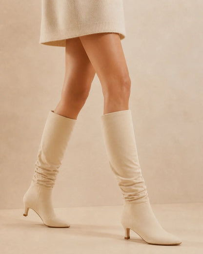Beige slouchy knee-high boots, movement view