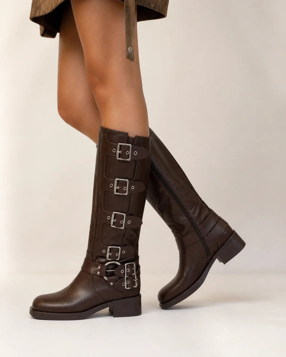 Brown knee-high multi-buckle biker boots side profile
