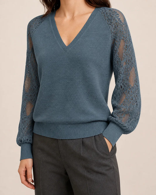 Women's Storm Blue ribbed V-neck sweater with floral lace sleeves, worn front three-quarter hero view.