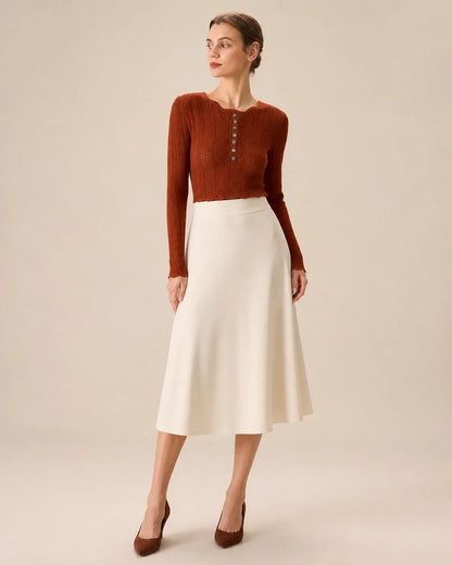 Women's rust fitted button-detail knit top styled with cream midi skirt